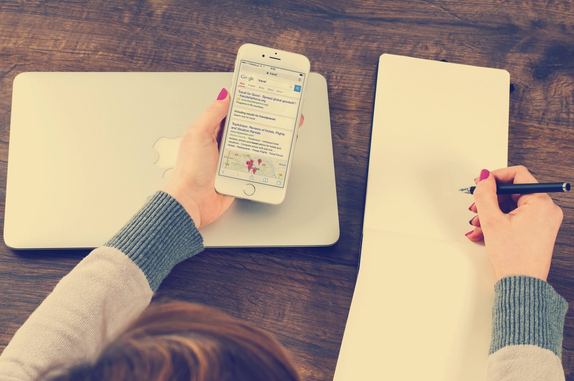executive writing and phone