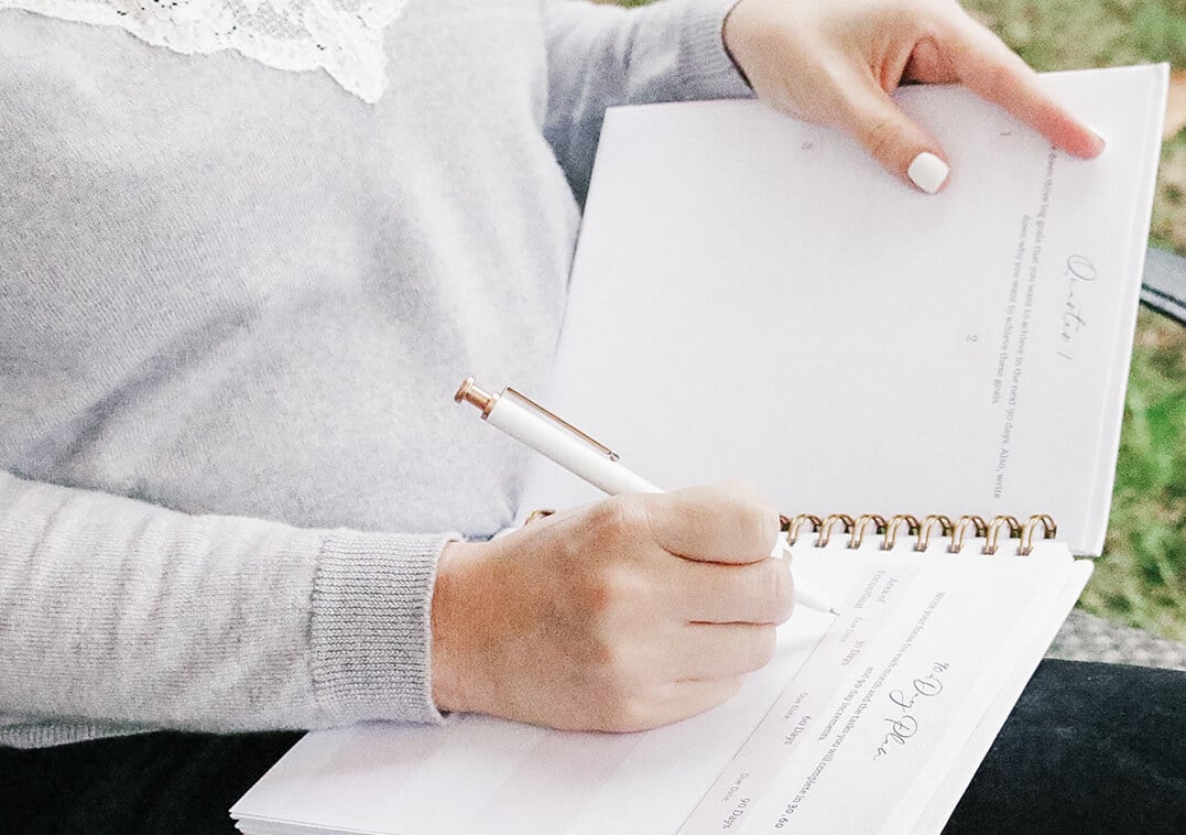Girl Planning using Create Your Future DIY Planner