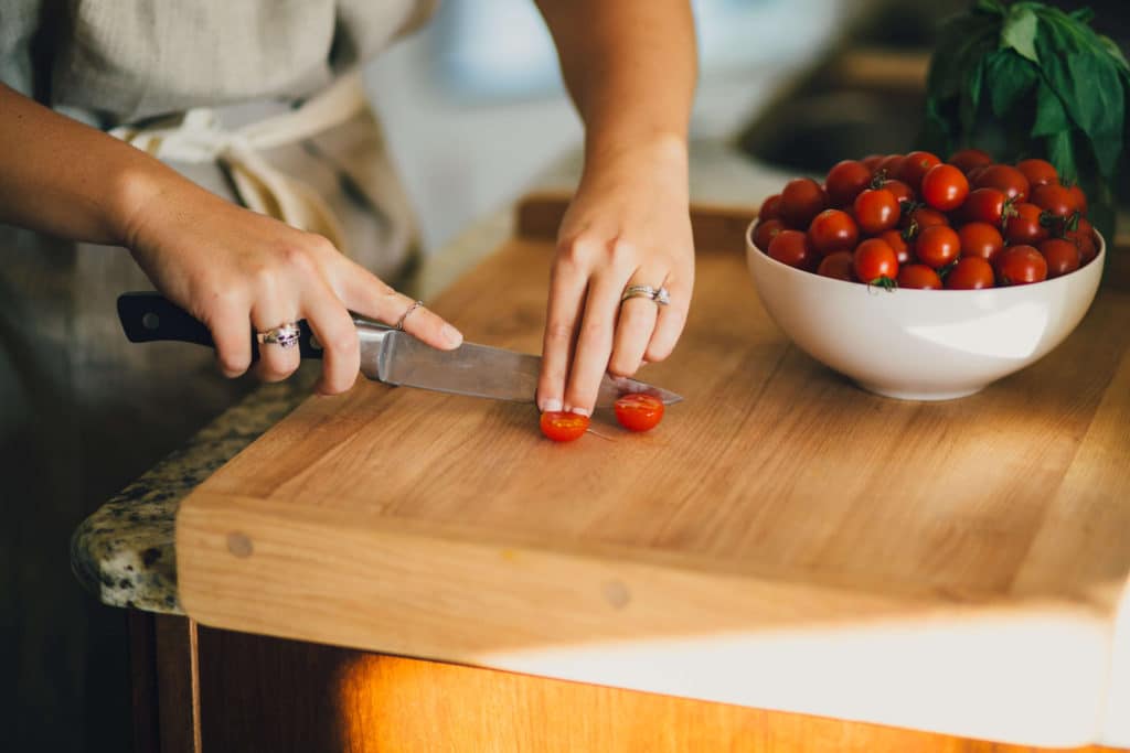 cutting-tomatoes by Claire Trost
