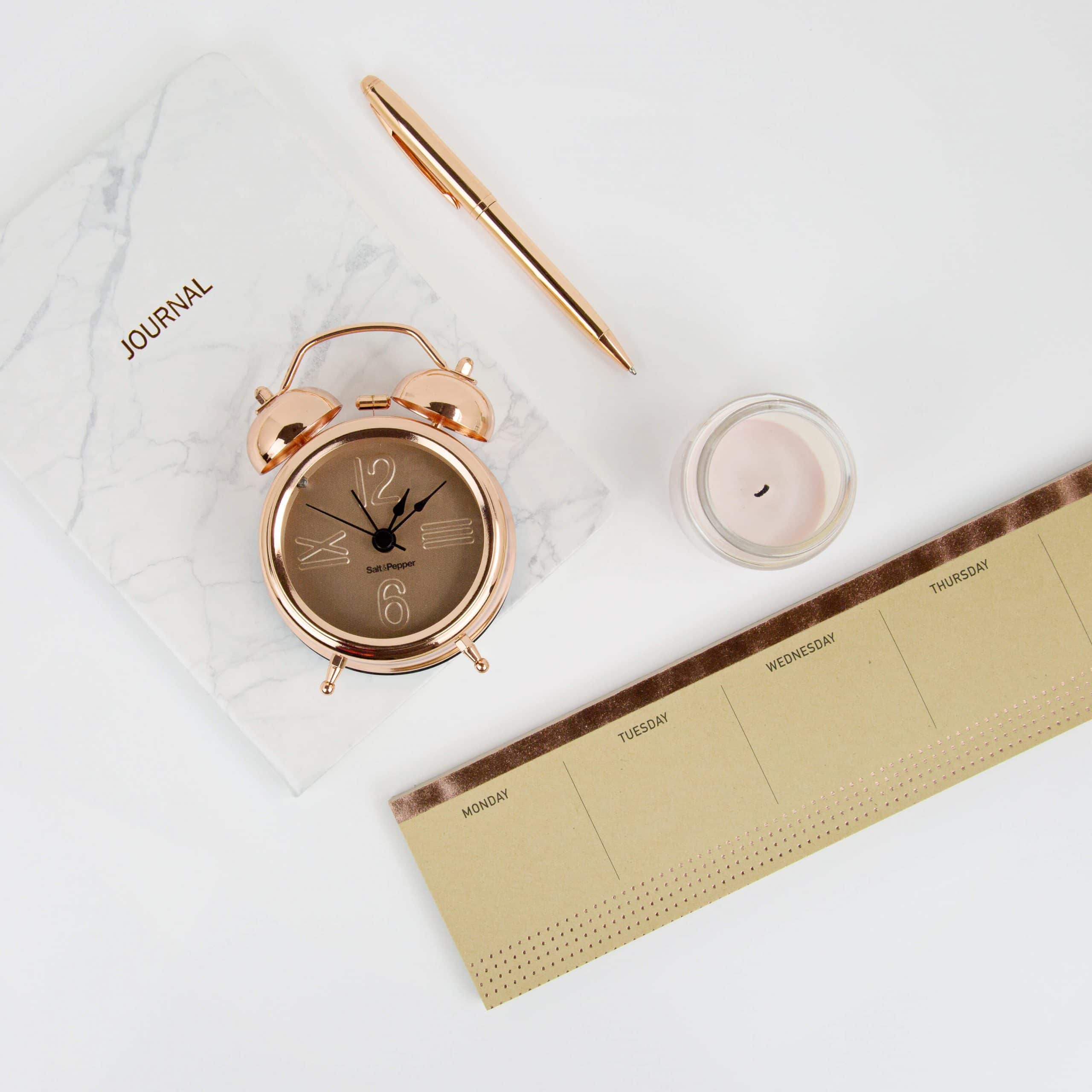 Journal clock and to-do list flat lays If you aren’t reaching your goals, it’s because of these 4 things